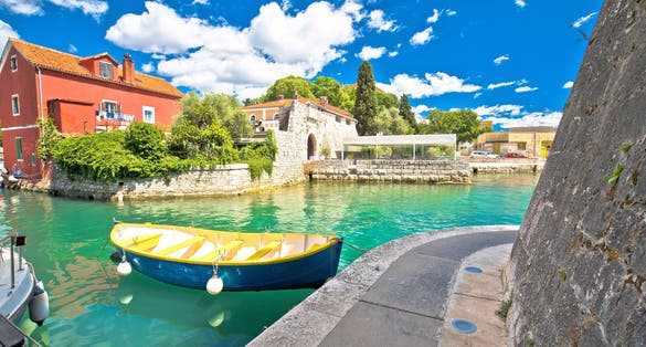 Photo of Zadar historic Fosa harbor bay in Zadar ,boats and architecture colorful view, Croatia.