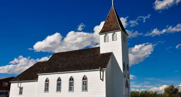 White Country Chapel sunny blue sky.