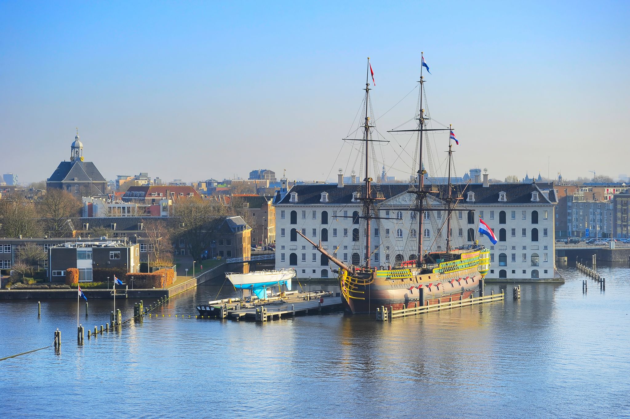 photo of skyline of Amsterdam with National Maritime Museum on the foreground. Netherlands.