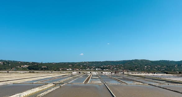 Photo of Saltworks in Strunjan, Piran, on the Slovenian Istrian coast. traditional oldest salt extraction area, salt basin, salt mining.
