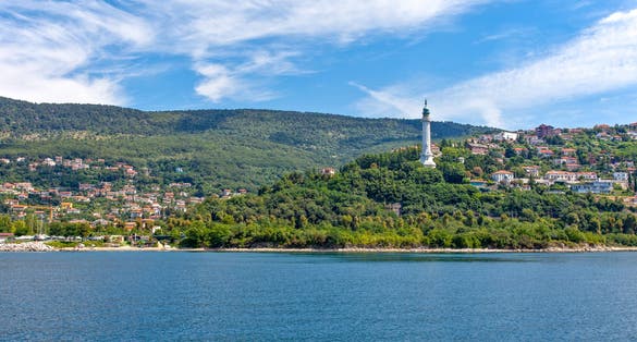 photo of Italy, Trieste, view of the Faro della Vittoria on the Riviera seafront .