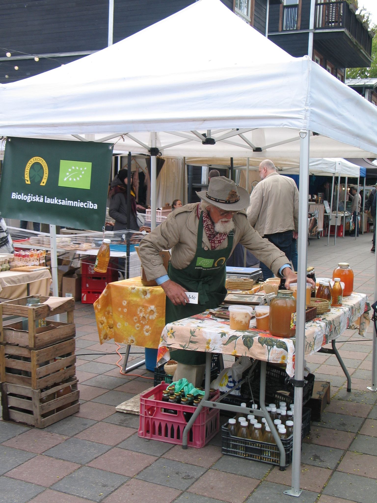 An Old Man Selling Honey at Kalnciema Quarter Market