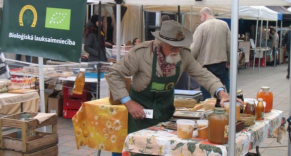 An Old Man Selling Honey at Kalnciema Quarter Market