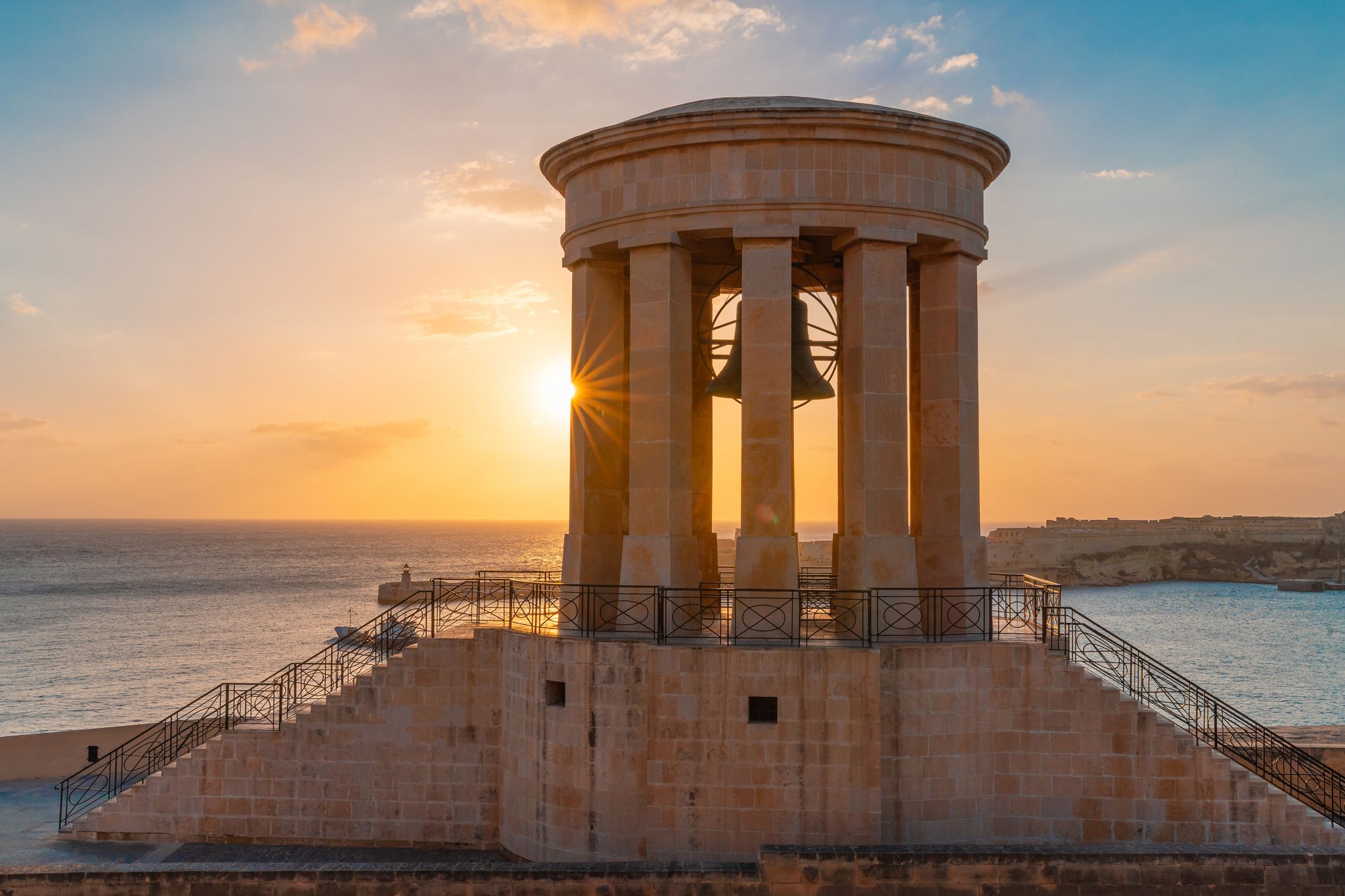 Photo of the Lower Barrakka Gardens at sunset in Valletta, Malta.