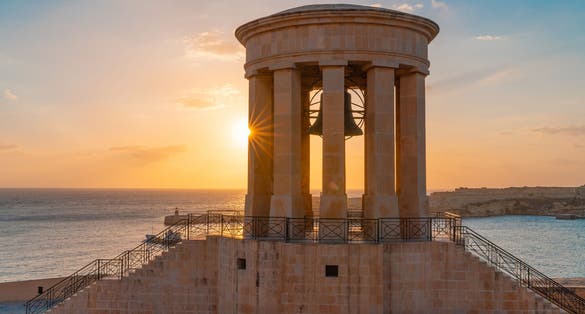 Photo of the Lower Barrakka Gardens at sunset in Valletta, Malta.