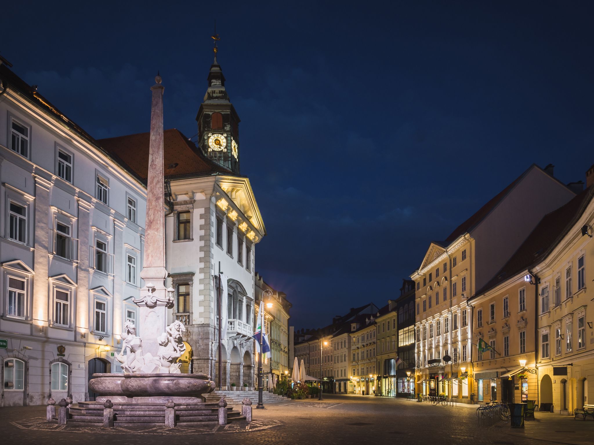 Photo of Town hall and Robba fountain at Mestni trg at night in Ljubljana, Slovenia.