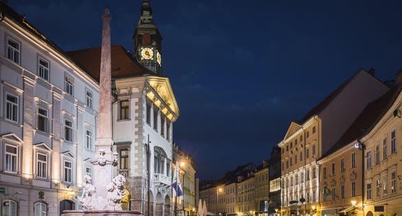 Photo of Town hall and Robba fountain at Mestni trg at night in Ljubljana, Slovenia.