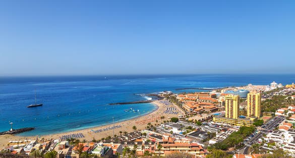 View of the beach and lagoon of Los Cristianos resort on Tenerife, Canary Islands, Spain