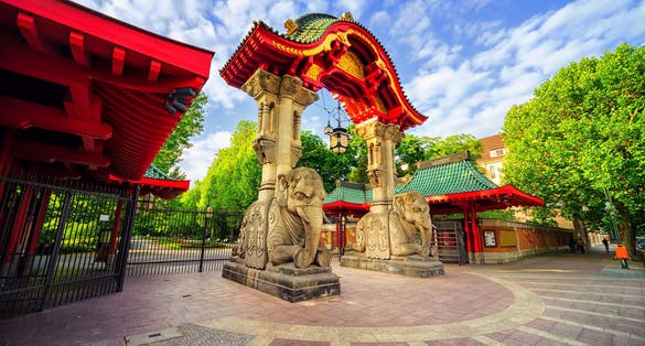 Photo of stone elephants and the arch on the entrance to the Berlin Zoological Garden, Germany.