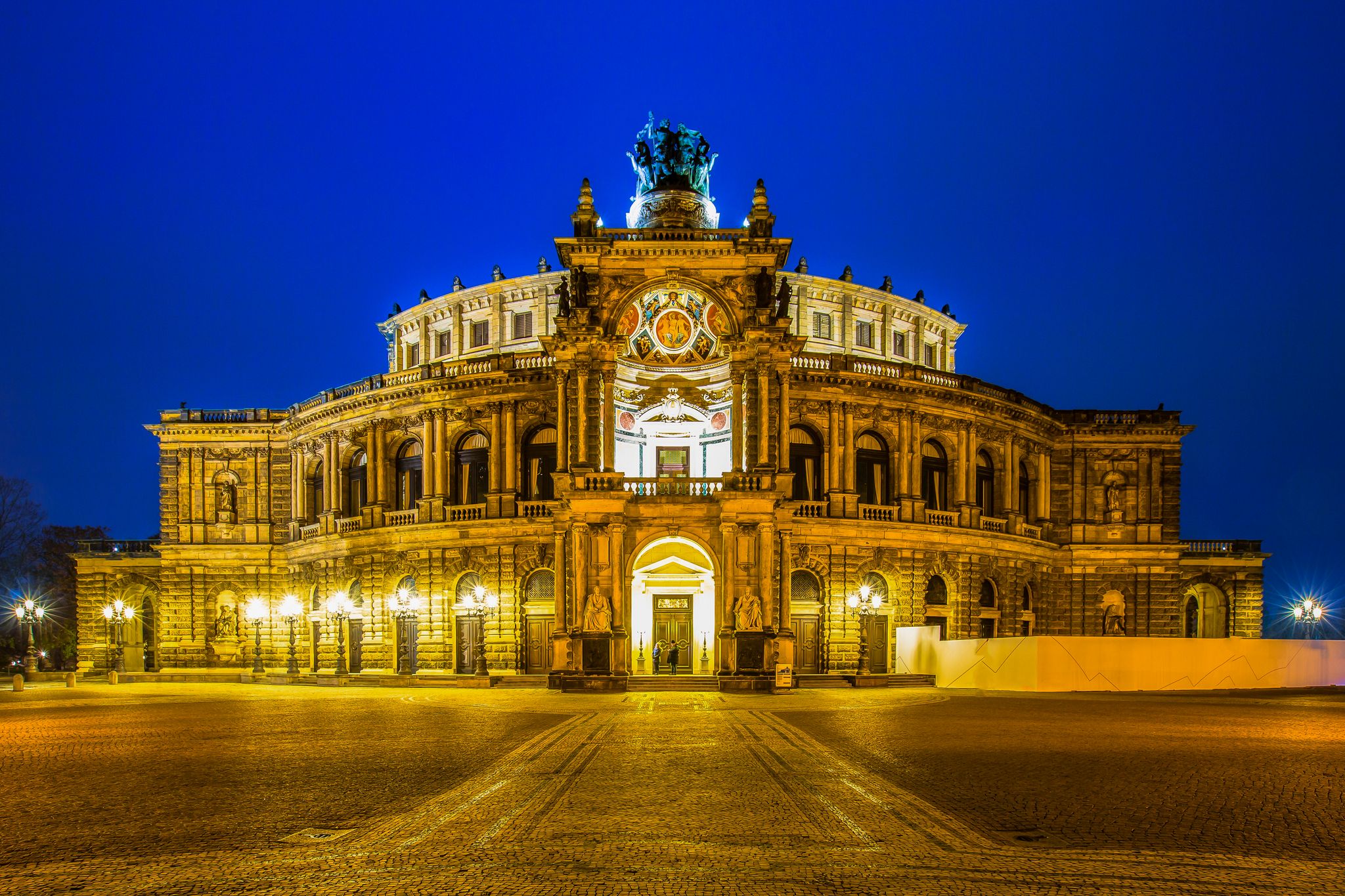 photo of view of DRESDEN, GERMANY - June 15, 2019: The famous opera house Semperoper in Dresden after a concert after sunset,Saxony  germany.