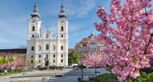 photo of view of A church and a grammar school at the Heroes Square in Miskolc, Hungary, Central Europe.