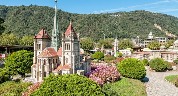 photo of Swissminiatur park in Melide, is an open-air museum with the most important Swiss buildings and means of transportation. Saint Pierre cathedral.