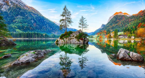 Photo of Fantastic autumn sunrise of Hintersee lake. Beautiful scene of trees on a rock island. Location: resort Ramsau, National park Berchtesgadener Land, Upper Bavaria, Germany Alps, Europe .