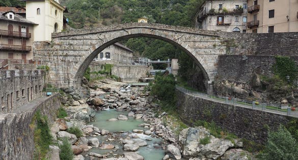 Ancient roman bridge over torrent Lys in Pont Saint Martin, Italy