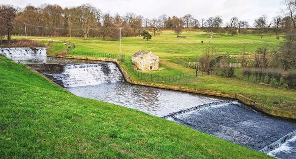 Photo of the waterfall at the Yorkshire Sculpture Park, Wakefield, Yorkshire, UK.