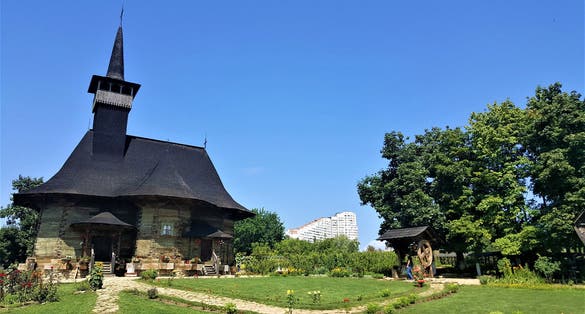 Village museum. Wooden church of the Dormition of Mary of Hirișeni, built in 1642 and restored recently. Chisinau City Gates (Portile Orasului) visible.