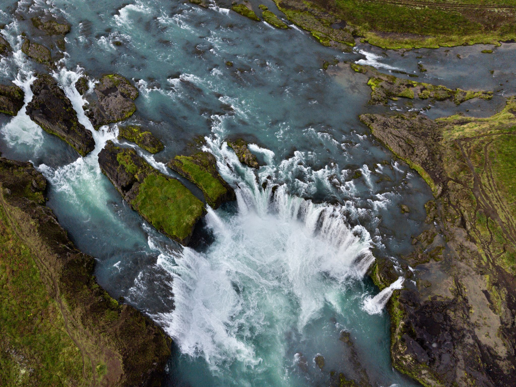 photo of skyview of godafoss (Goðafoss) waterfall. It one of the spectacular waterfalls in Iceland. Skjálfandafljót river. Aerial photography captured by drone.
