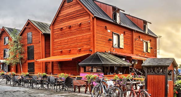 Photo of old wooden houses in the old center around the harbor of Oulu, Finland.