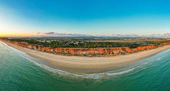 Praia da Falesia, Algarve beach in Albufeira, Portugal. Aerial drone view at sunset