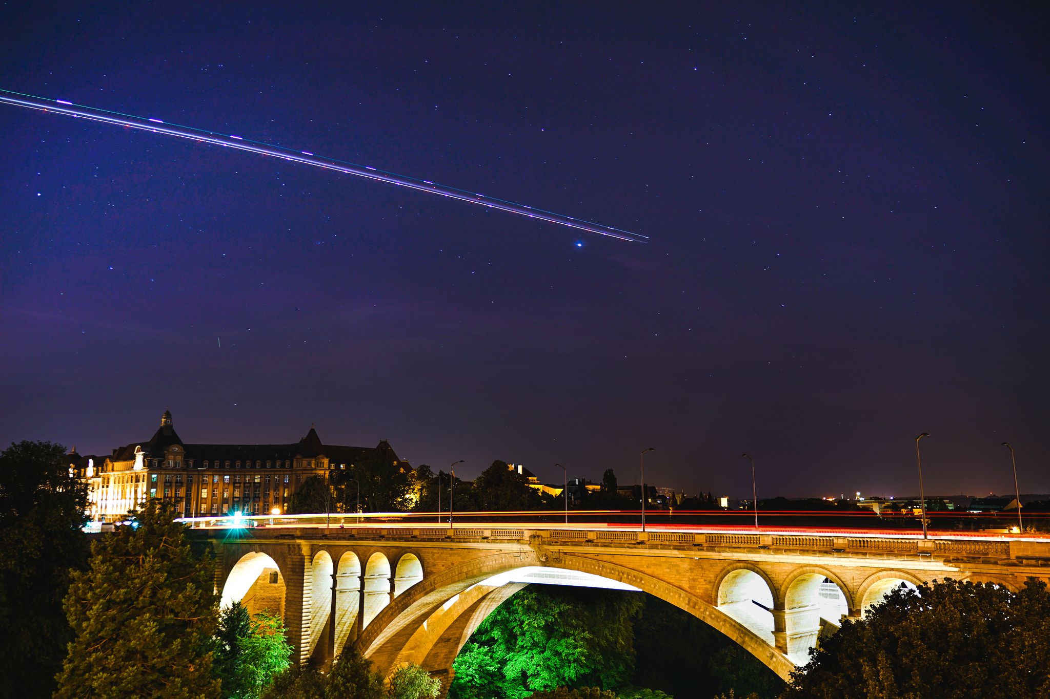 photo of adolphe bridge in Luxembourg city at night.