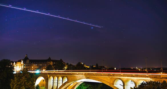 photo of adolphe bridge in Luxembourg city at night.