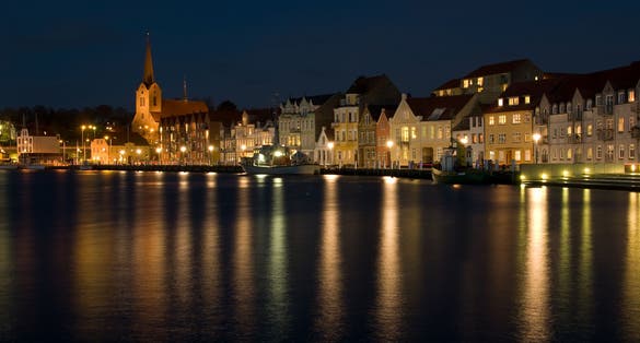 Harbour. the lights of the evening city reflexed in the river.Sonderborg , Denmark