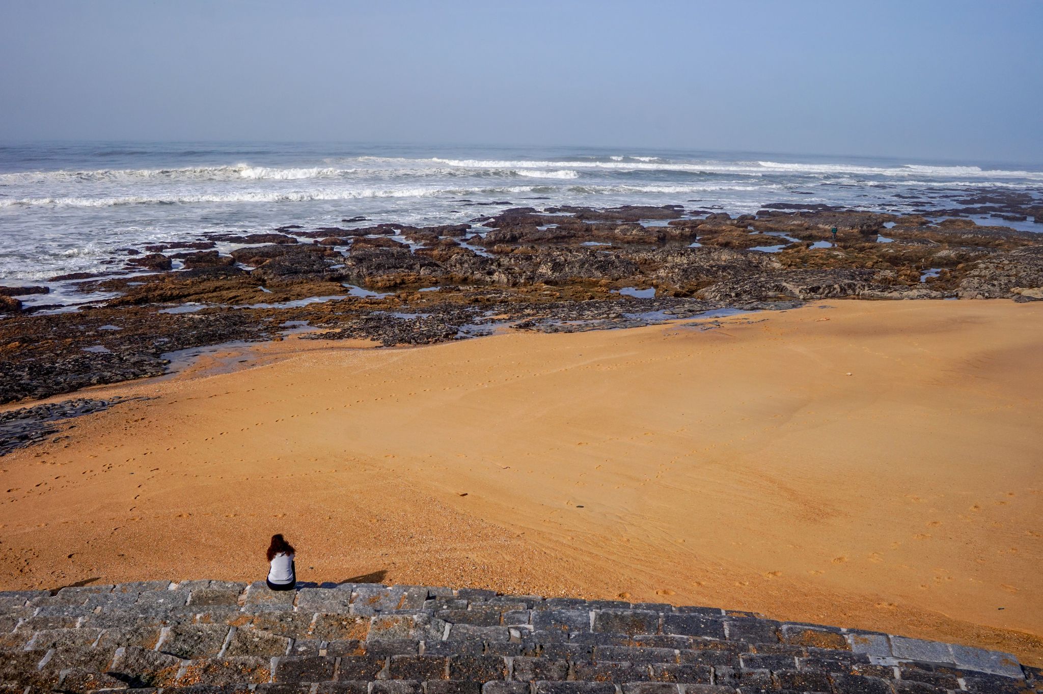 Women enjoying beach landscape view on sunny day at Praia da Granja, Gaia, Portugal