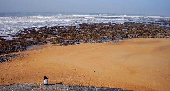 Women enjoying beach landscape view on sunny day at Praia da Granja, Gaia, Portugal