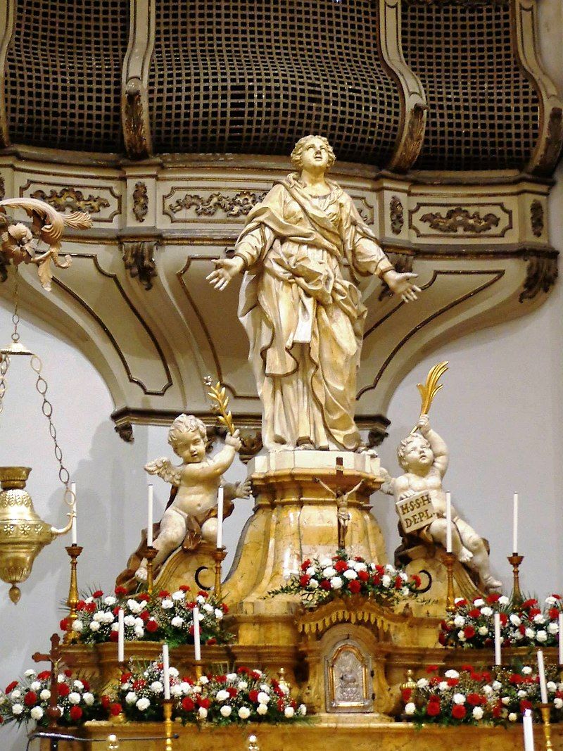 photo of view of  Download original file 1535 × 2048 px jpg View in browser You need to attribute the author  Show me how  More details Statue of St Agatha at main altar. Behind is the nuns viewing area with a metal grid. The altar is made from amber-like yellow Castronovo marble, Catania, Italy.