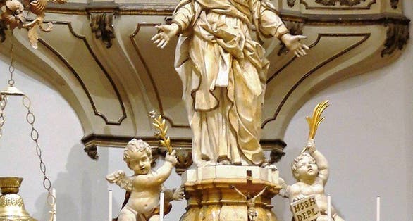 photo of view of  Download original file 1535 × 2048 px jpg View in browser You need to attribute the author  Show me how  More details Statue of St Agatha at main altar. Behind is the nuns viewing area with a metal grid. The altar is made from amber-like yellow Castronovo marble, Catania, Italy.