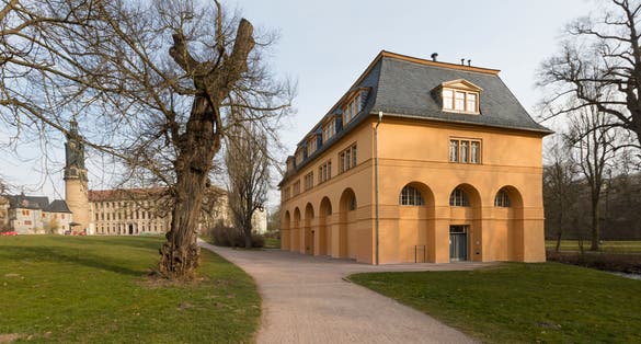 photo of view of The Reithaus at Park an der Ilm with City Castle of Weimar in background, Weimar, Germany.