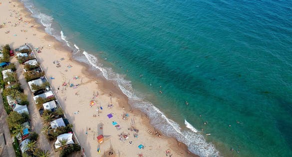 Summer on Tamarit beach, sunset.
