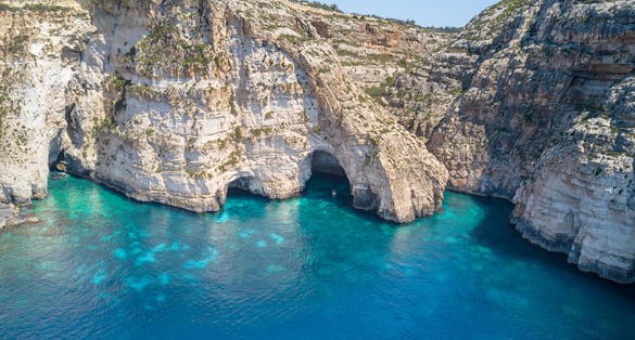 Photo of beautiful Blue Grotto caves and cliff in Malta.
