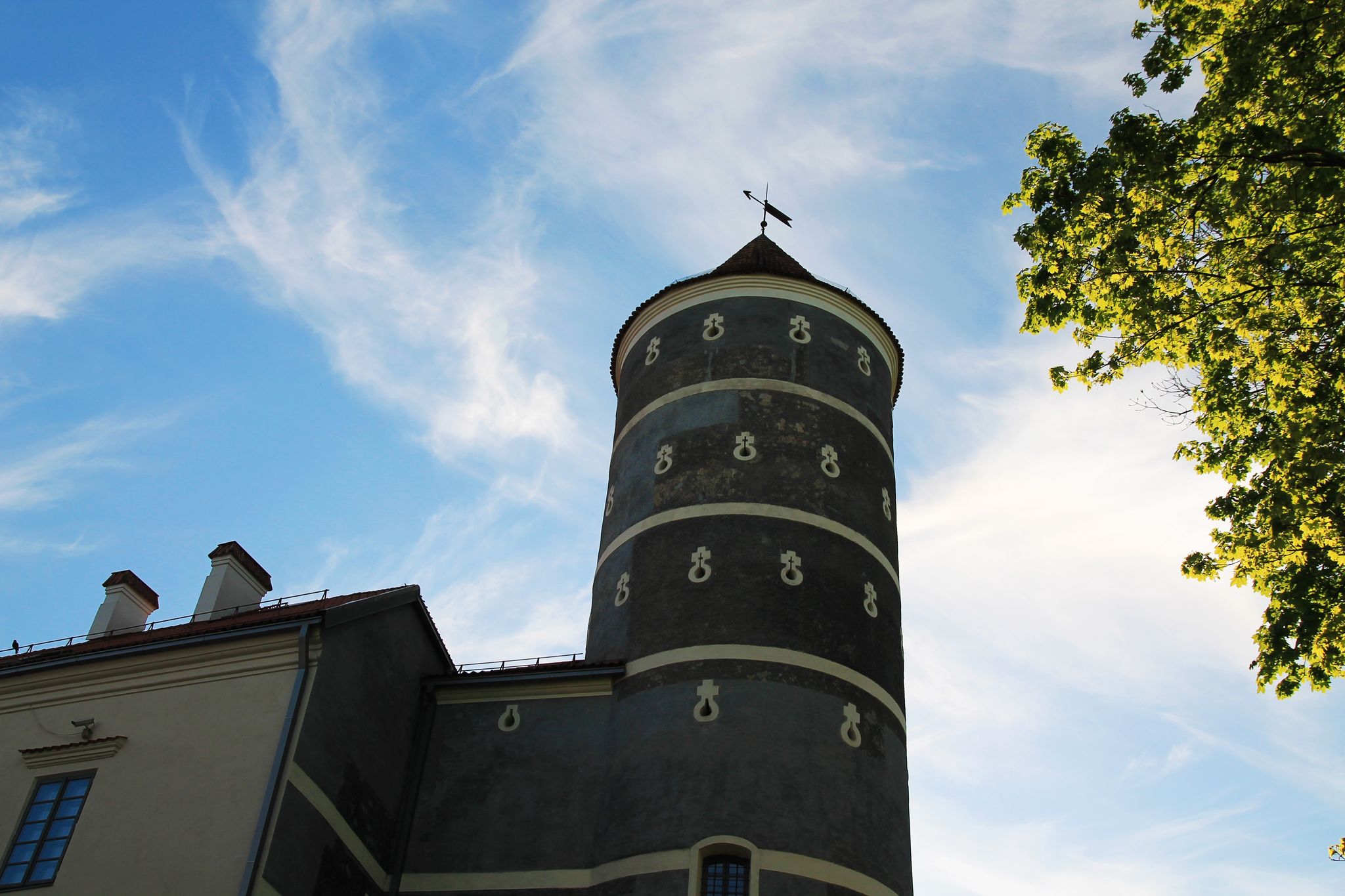Panemune Castle with green trees and blue sky. Castle on the right bank of the Nemunas river, in Vytėnai, Jurbarkas district, Lithuania. One of the most beautiful Renaissance era building in Lithuania