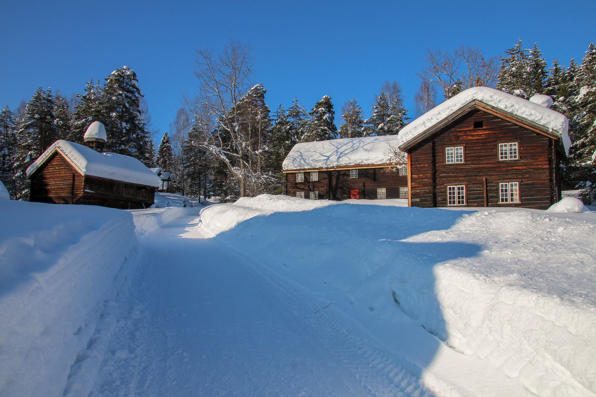 Old snow-covered wooden log houses in Norway, Gjøvik