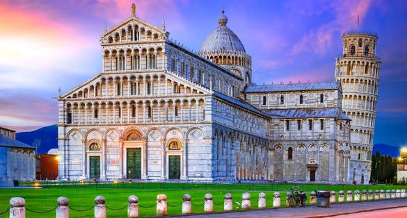Blue hour twilight with Duomo and world famous Leaning Tower travel background in Tuscany.