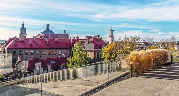 Photo of view from the observation deck of the Memorial to the Heavenly Hundred Heroes to the red tiled roof of the old Fire Station in Lviv, Ukraine.