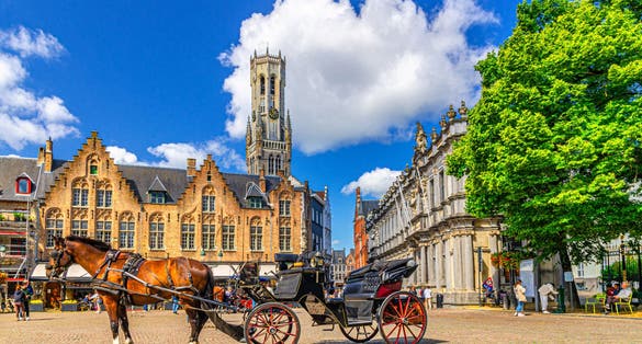 Horse-drawn carriage cart on cobblestone Burg square, medieval buildings and Belfry of Bruges Belfort van Brugge bell tower in Brugge old town, Bruges city historical centre, Flemish Region, Belgium