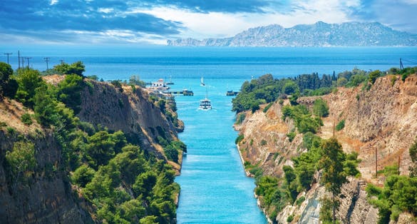 Photo of scenic landscape of the Corinth Canal in a bright sunny day against a blue sky ,Greece.