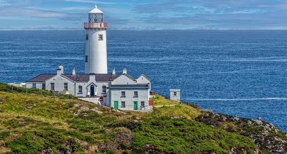 photo of view of Lighthouse perched on hill, ocean view at Municipal District of Letterkenny - Milford, County Donegal, Ireland.