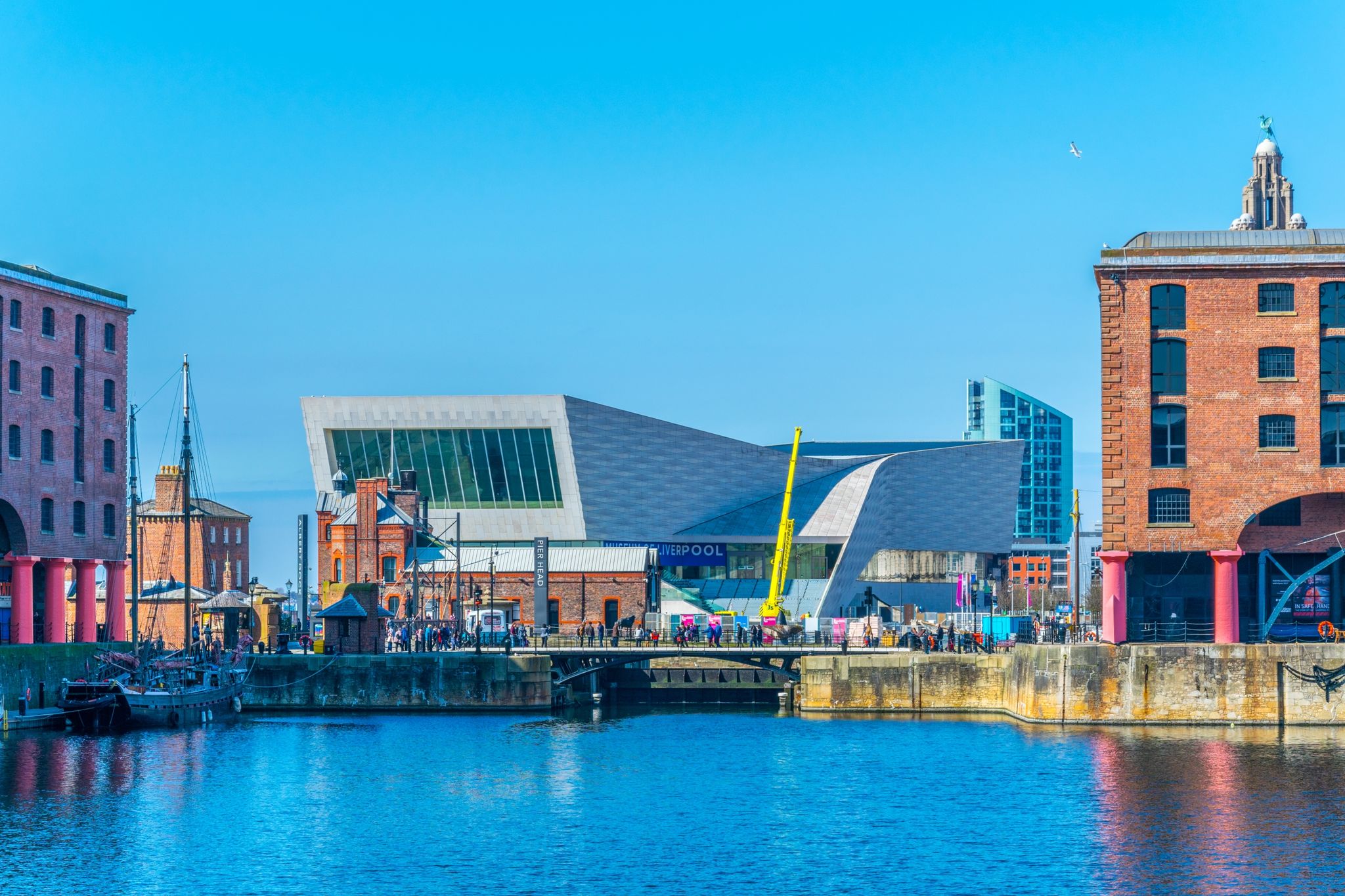 Photo of waterside of Liverpool dominated by the museum of Liverpool, England.