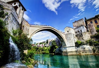 Photo of Stari Most is a reconstruction of a 16th-century Ottoman bridge in the city of Mostar in Bosnia and Herzegovina that crosses the river Neretva and connects two parts of the city.