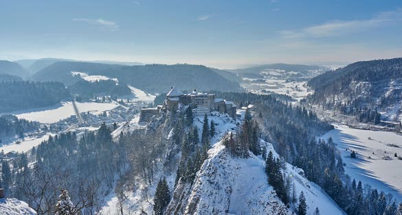 photo of view of Views of Chateau de Joux Covered In Snow - La Cluse et Mijoux - France.