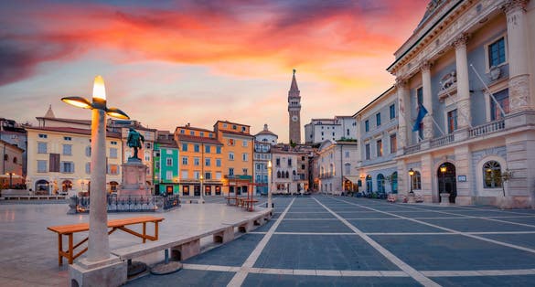 Impressive evening view of Tartini Square in old town of Piran. Picturesque summer sunset in Slovenia, Europe.