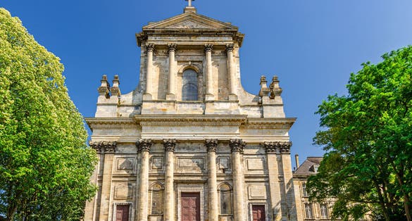 Arras Cathedral of Our Lady and Saint Vaast Cathedrale Notre-Dame catholic church gothic style building and green trees, summer day blue sky, Artois, Pas-de-Calais department, Northern France