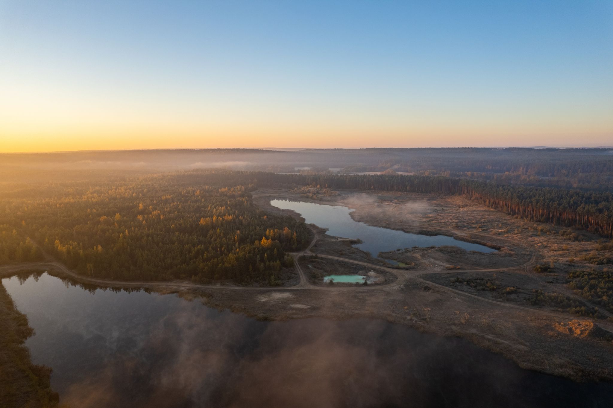 photo of aerial autumn fall sunrise dawn view in neris regional park, Lithuania.