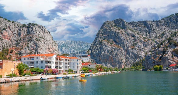 Photo of town in Dalmatia where Cetina River meets the Adriatic Sea ,Omis ,Croatia.