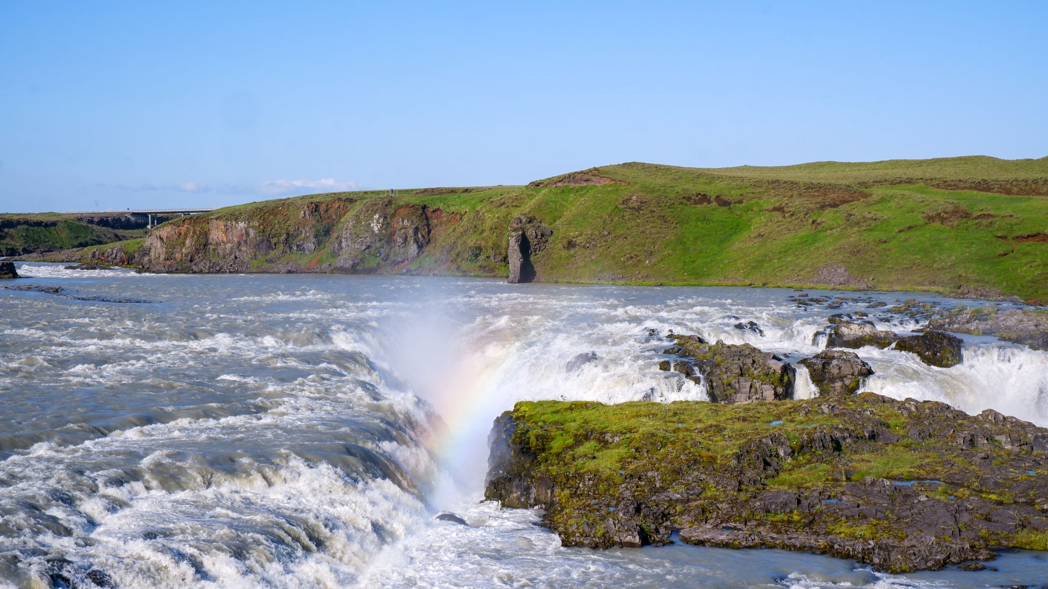 photo of rainbow over the Urriðafoss waterfall in the river Þjórsá, South Iceland.