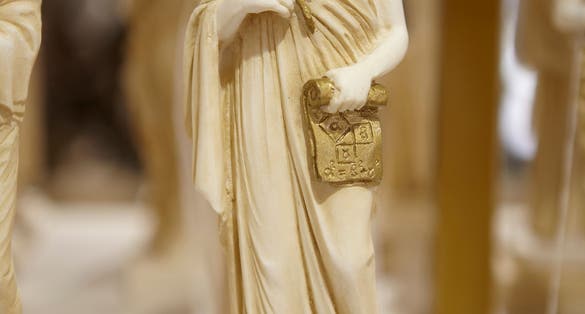 photo of view of Pythagoras statue souvenir for sale,Pythagorio Greece.