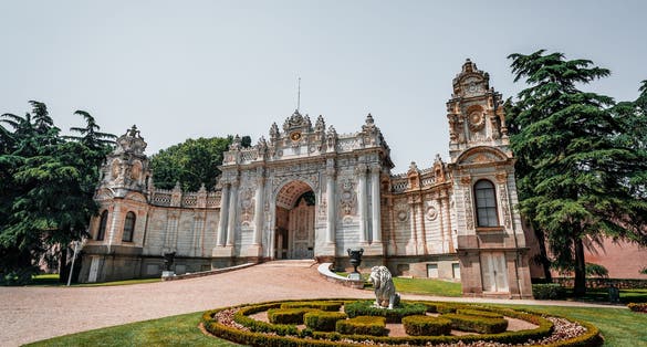 The Topkapı Palace surrounded by a garden under the sunlight in Istanbul, Turkey.